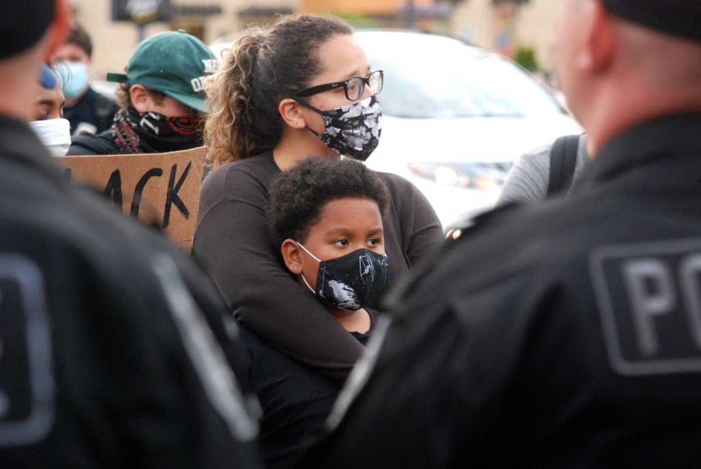 This image has an empty alt attribute; its file name is 20200602-225543-001_mer_protest_mother.jpg